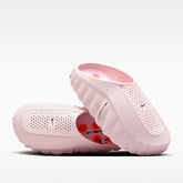 Pink Nike slippers on a white background
Nike Mind 001
Women's Pregame Mules